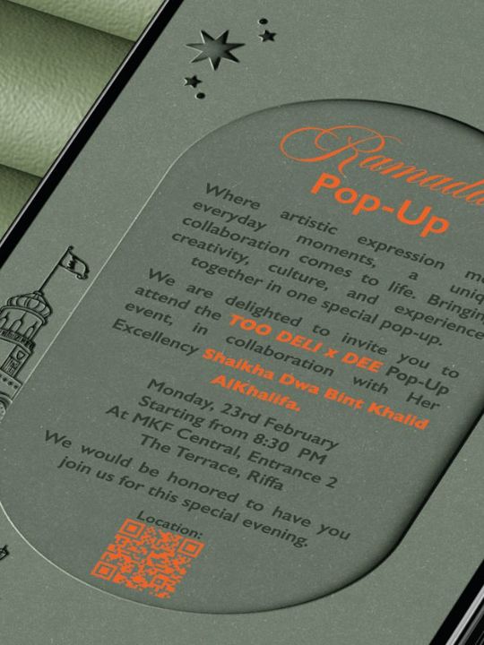 Too x Dee Ramadan pop-up invitation on a phone